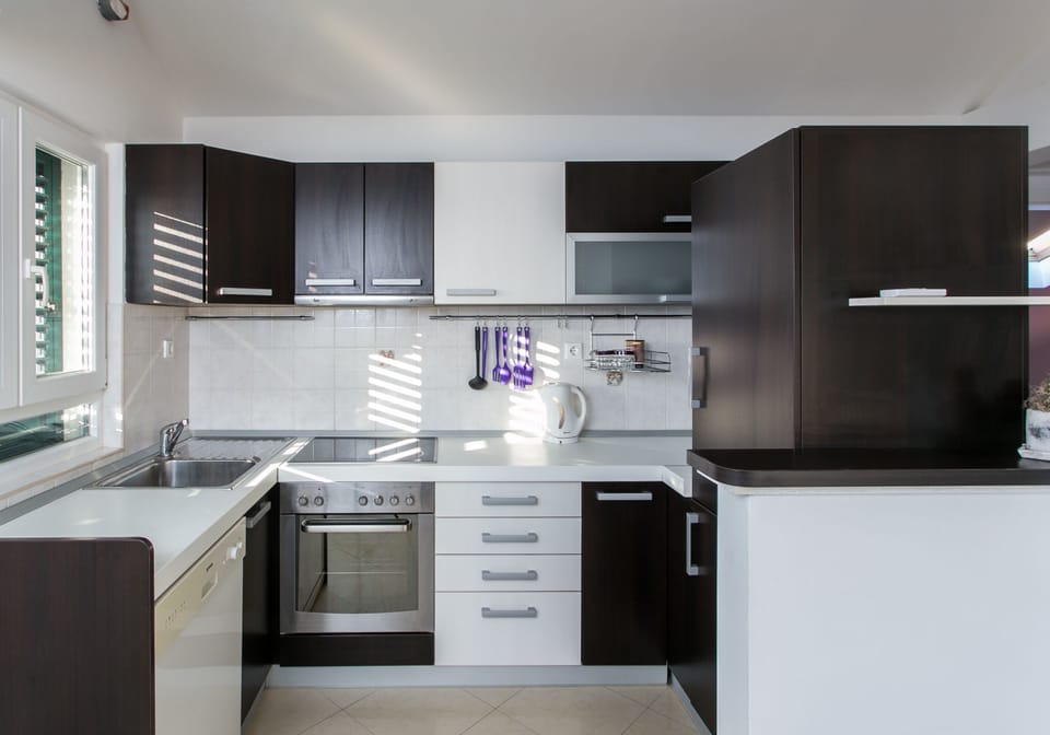 Apartment (Two-Bedroom Apartment with Balcony) | Private kitchen | Fridge, microwave, stovetop, coffee/tea maker