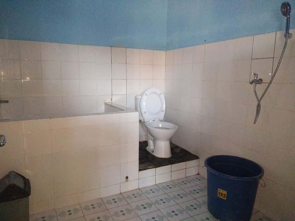 Shower, slippers, bidet, towels