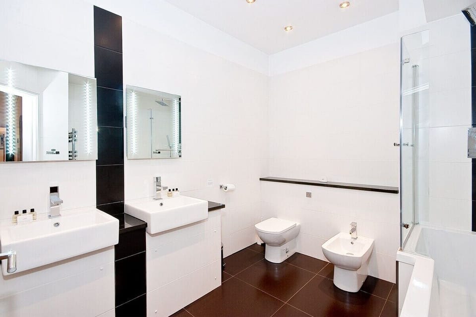 Bathroom with Shower Over and Twin Wash Hand Basins