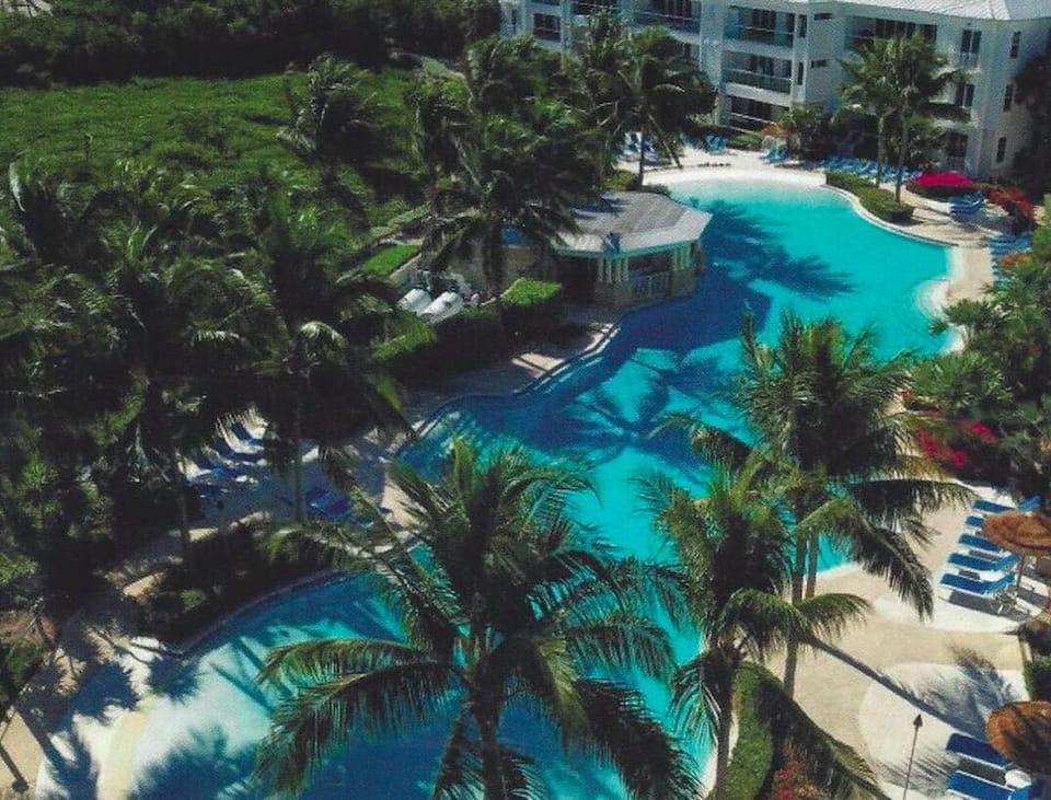 Zero entry pool, just steps from a sandy beach and the condo