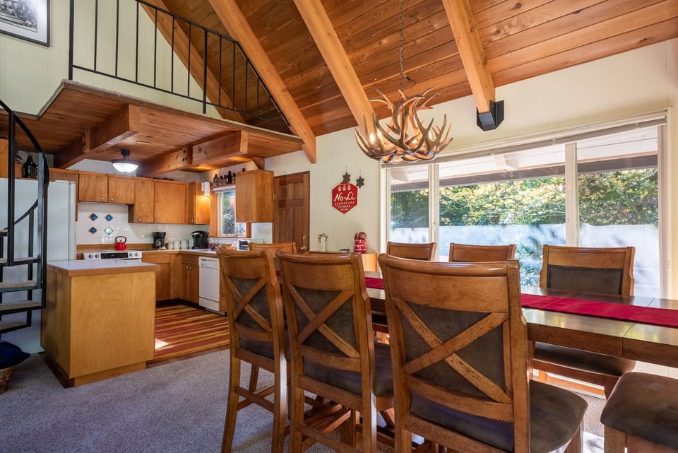 Dining Room - Dining room and kitchen. There is also a door with access to the back porch.
