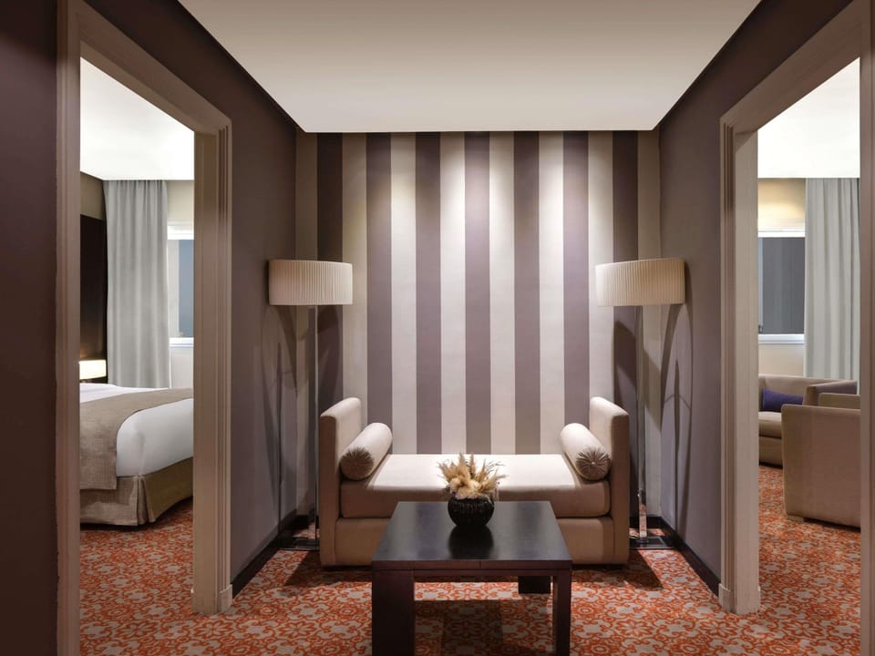 Premium bedding, down comforters, minibar, in-room safe