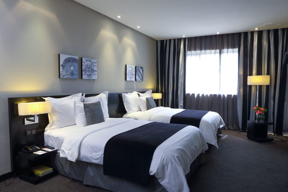 Premium bedding, down comforters, minibar, in-room safe