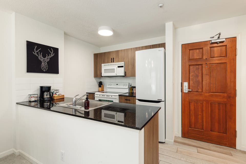 Kitchen - fully stocked with cooking basics and coffee, tea, and hot chocolate. Ideal for those who are not looking to eat out every meal!