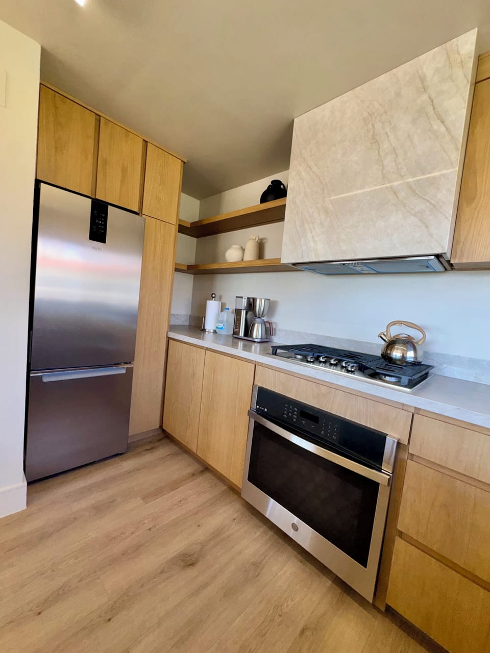 Modern Wabi-Sabi kitchen featuring Taj Mahal quartz countertops  