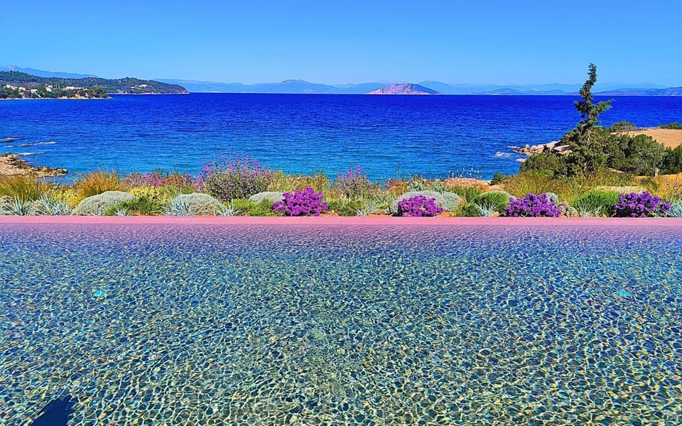 The pool meets the sea, creating a peaceful,endless view of blue and tranquility