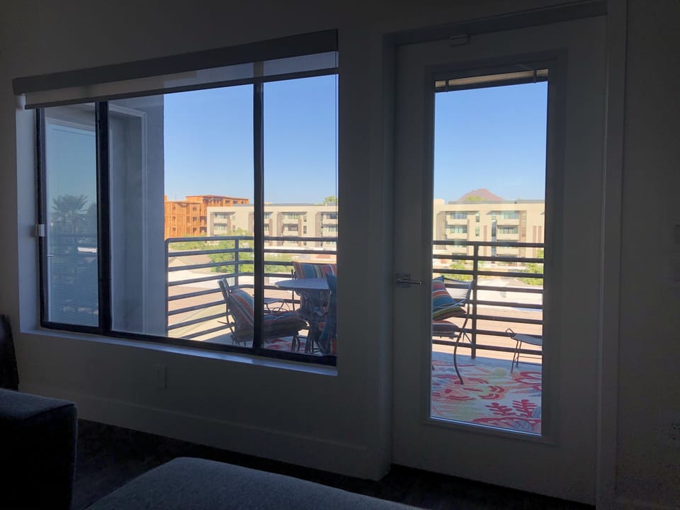 Cozy balcony for coffee or dinner al fresco.