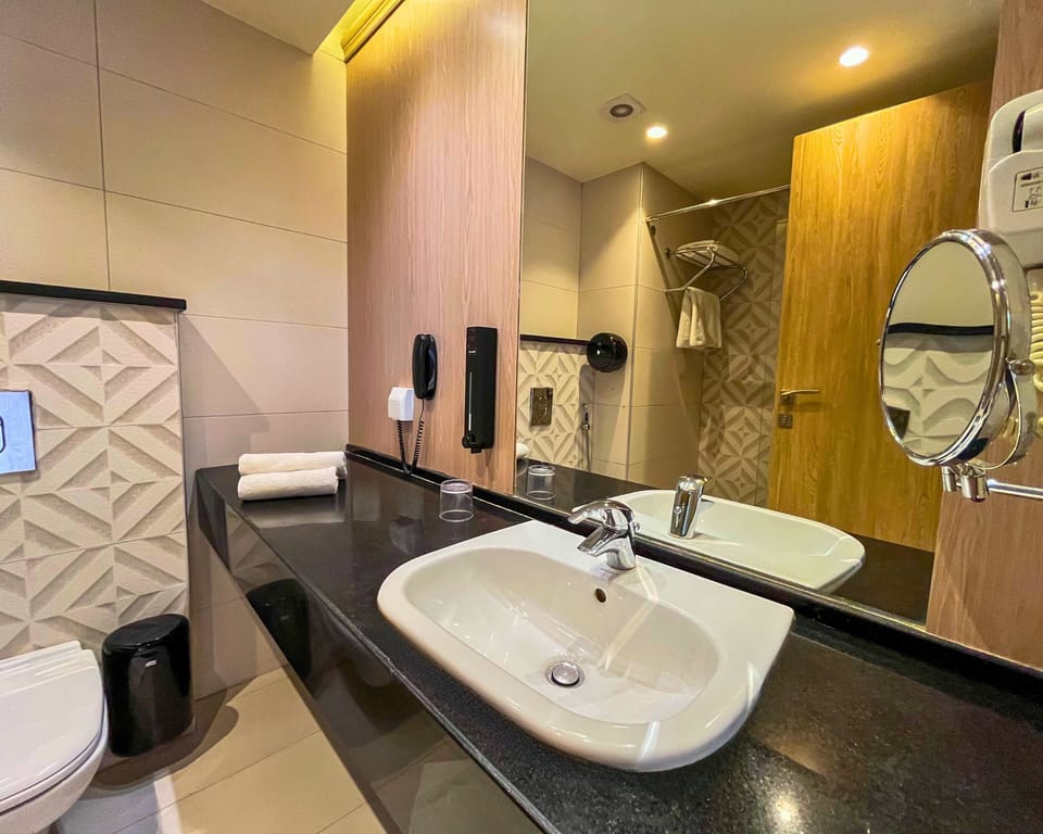 Shower, hair dryer, slippers, towels