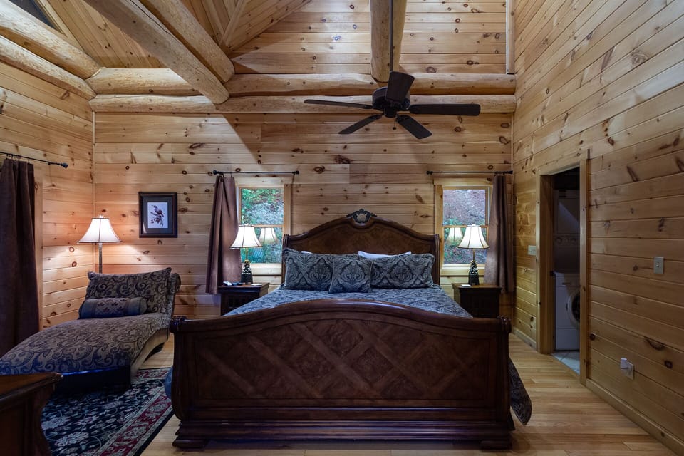 King size bed and chaise lounge in master bedroom