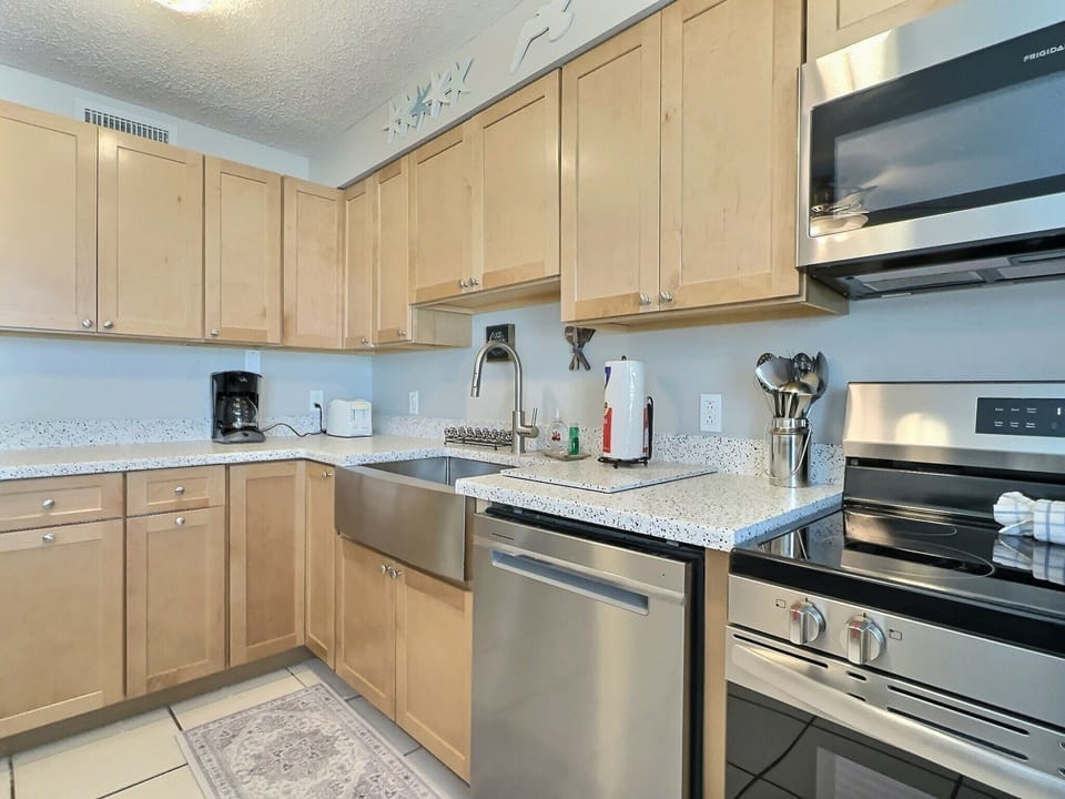 Full kitchen with wood cabinets, stainless appliances, and ample counter space
