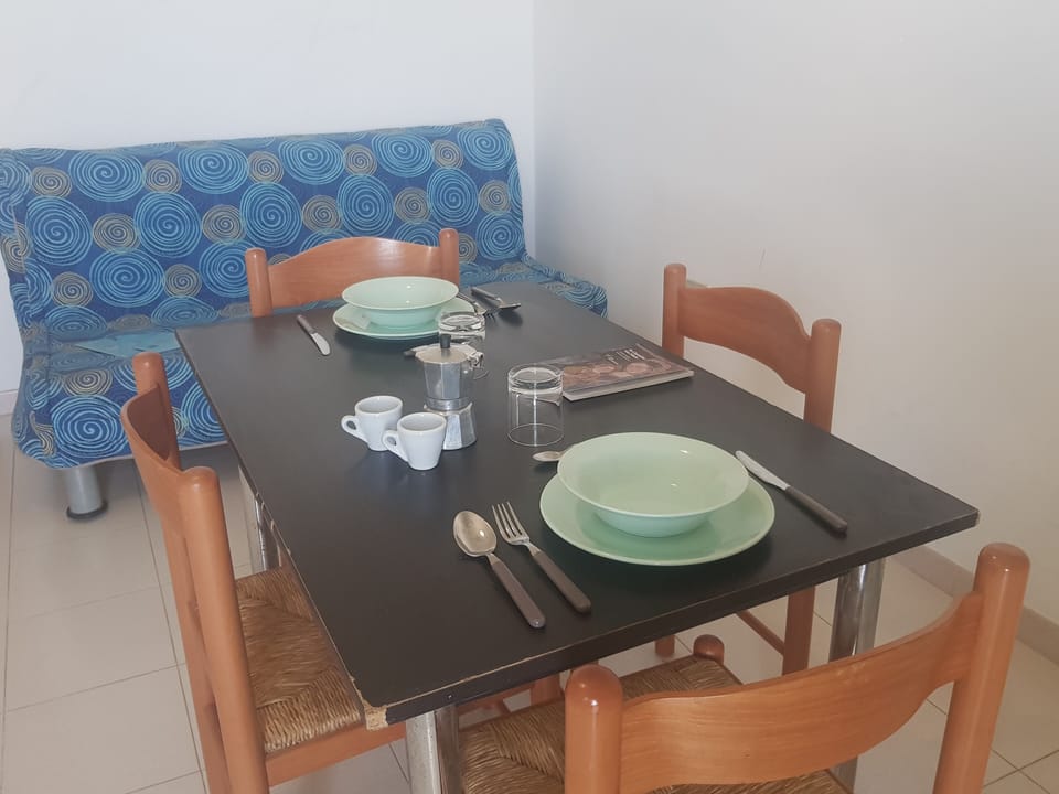 Apartment, 1 Bedroom (Bilocale Europa 90) | Living area | Flat-screen TV