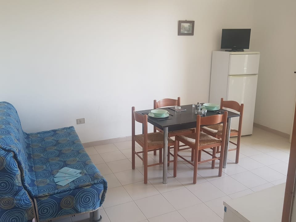 Apartment, 1 Bedroom (Bilocale Europa 90) | Living area | Flat-screen TV