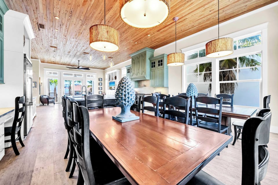2 Large Dining Tables Are Just Off Of The Kitchen, and Provide Dining Space For Everyone.