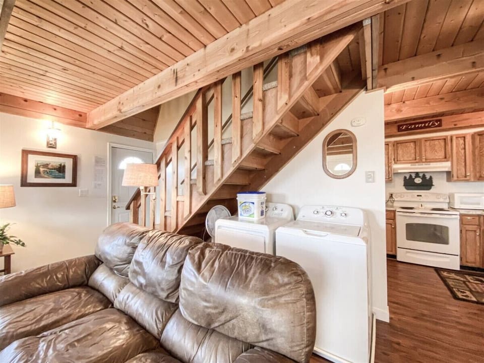 Cozy cabin charm with convenient in-home laundry and warm wood accents throughout
