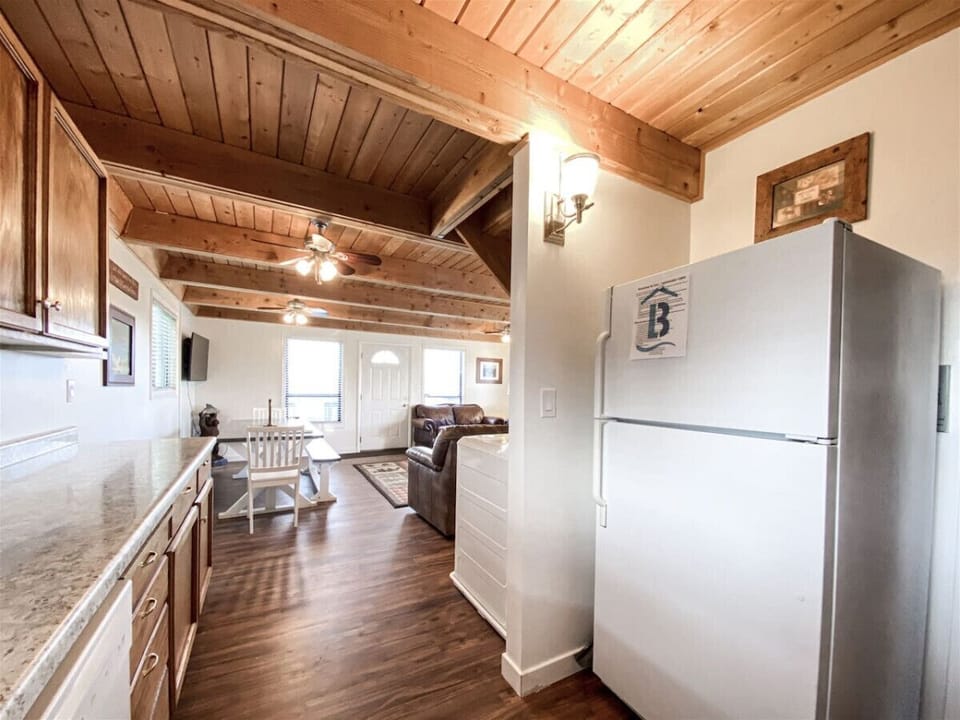 Warm, open kitchen and dining space with rustic charm—perfect for shared meals and family moments