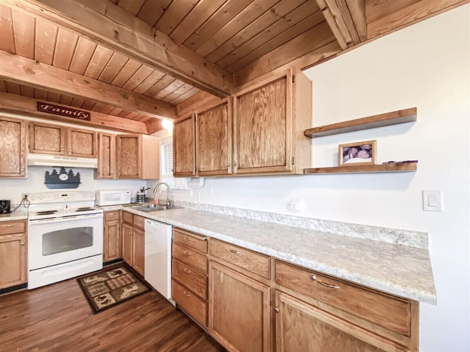 Rustic kitchen with ample counter space, perfect for preparing hearty meals and gathering together