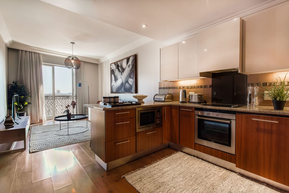 Signature Apartment | Private kitchen | Full-size fridge, oven, stovetop, electric kettle