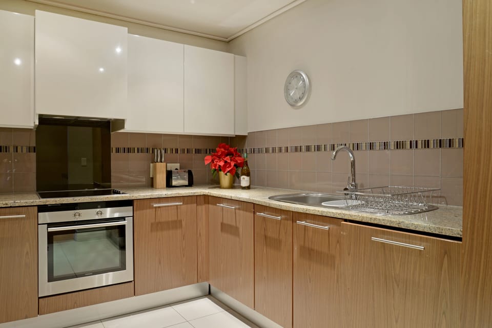 Signature Apartment | Private kitchen | Full-size fridge, microwave, oven, stovetop