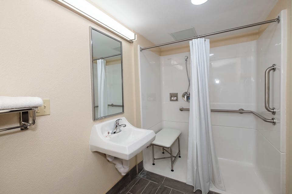 Superior Room, 1 King Bed, Accessible (Roll-In Shower, Smoke Free) | Bathroom | Shower, free toiletries, hair dryer, towels