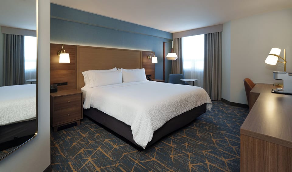 Hypo-allergenic bedding, pillowtop beds, desk, blackout drapes