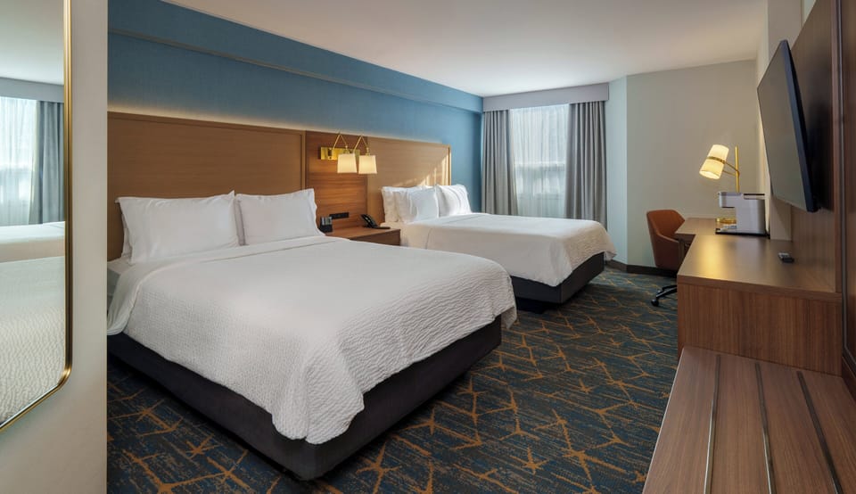Hypo-allergenic bedding, pillowtop beds, desk, blackout drapes