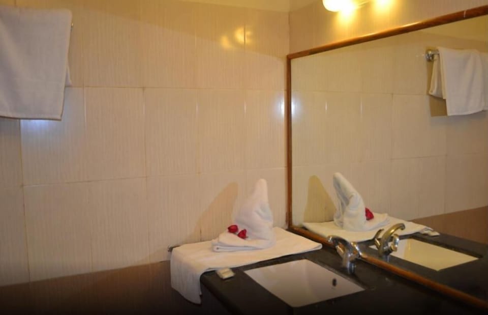 Shower, free toiletries, slippers, towels
