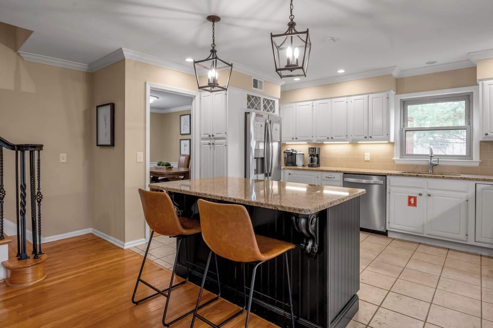 This bright, clean-lined kitchen is designed for effortless cooking and gathering. Enjoy abundant natural light, sleek stainless fixtures, and generous counter space that makes meal prep easy and enjoyable for families and groups.