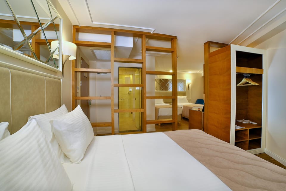 Family Room | Minibar, in-room safe, iron/ironing board, free WiFi