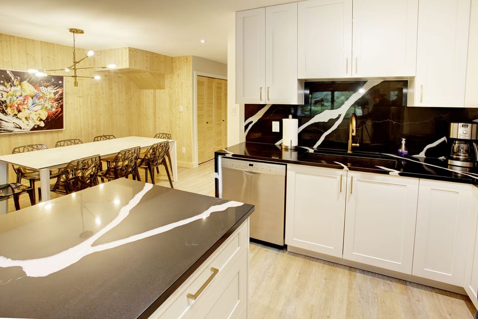 Open concept an fully equipped and remodelled kitchen with stainless appliances 
