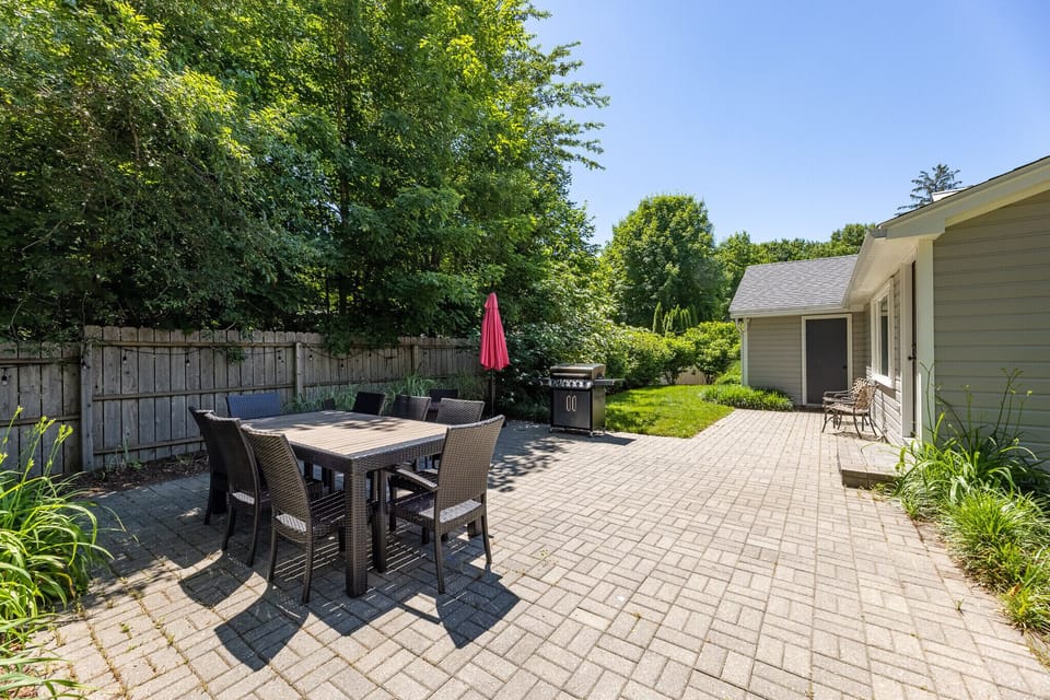 Very private “magical” backyard with dining table, lawn games, and party lights