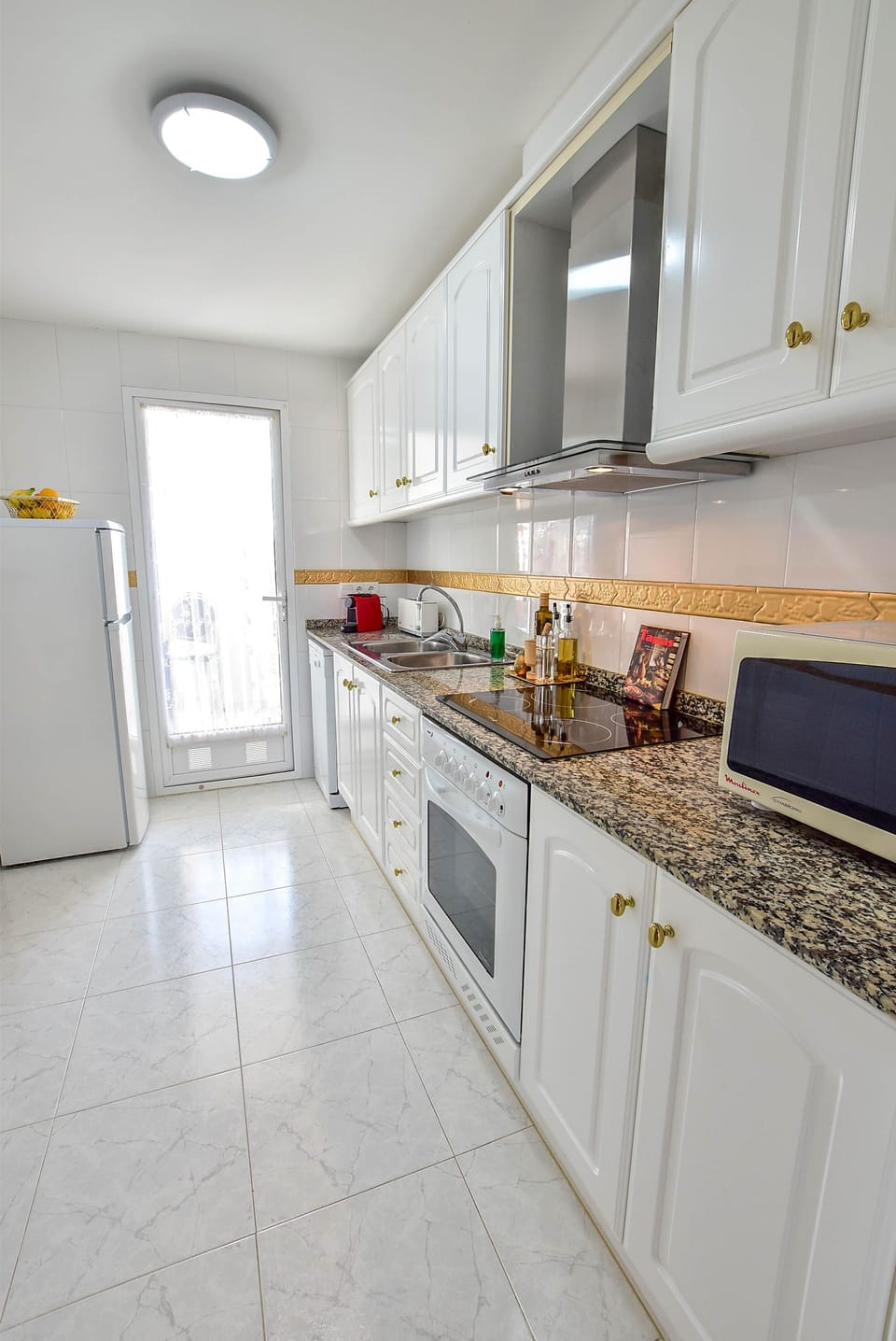 Well equipped, separate kitchen m'wave, s/steel extractor hood, fridge freezer.
