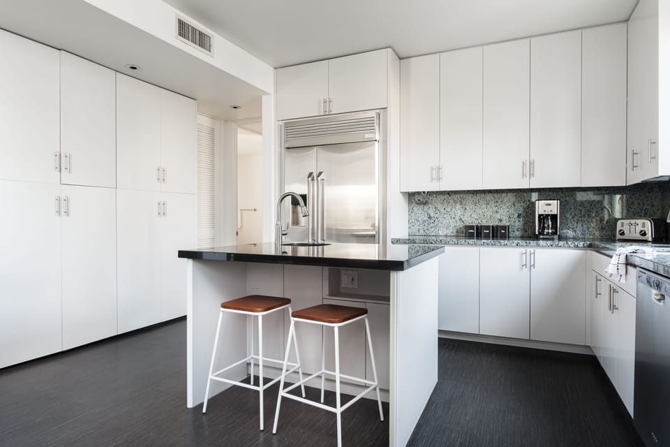 Sleek kitchen features modern applainces.
