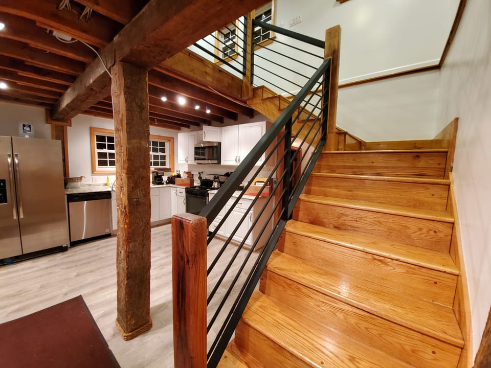 custom made handrails lead you to upstairs livingroom / bedroom 