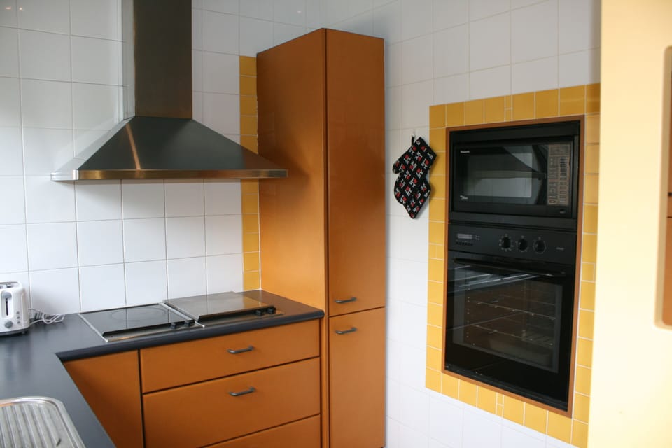Kitchen upstairs : Electric Cooktop stove with BBQ grill , oven and microwave.