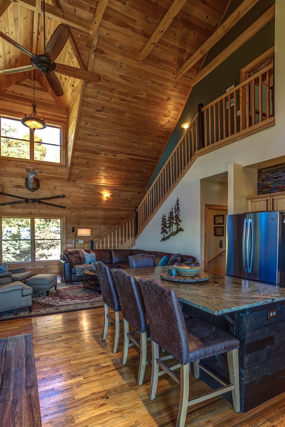 Huge two-story den and kitchen area with vaulted ceilings