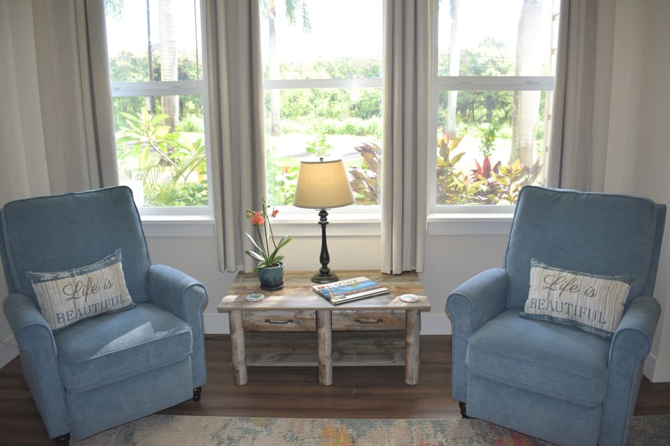 Living room seating provides a view of the beautiful mountains to the east