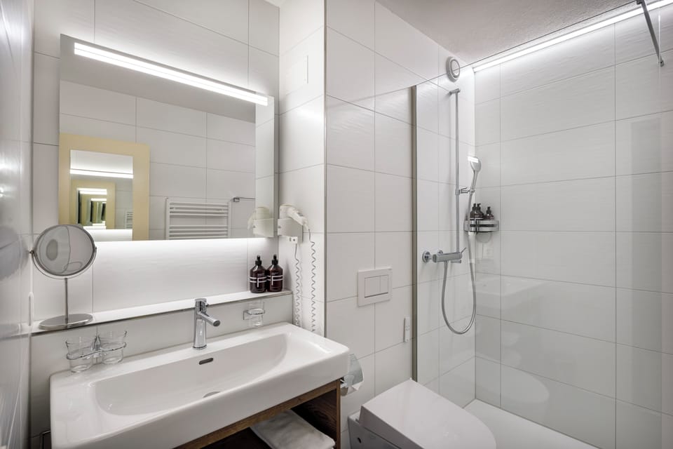 Shower, free toiletries, hair dryer, slippers