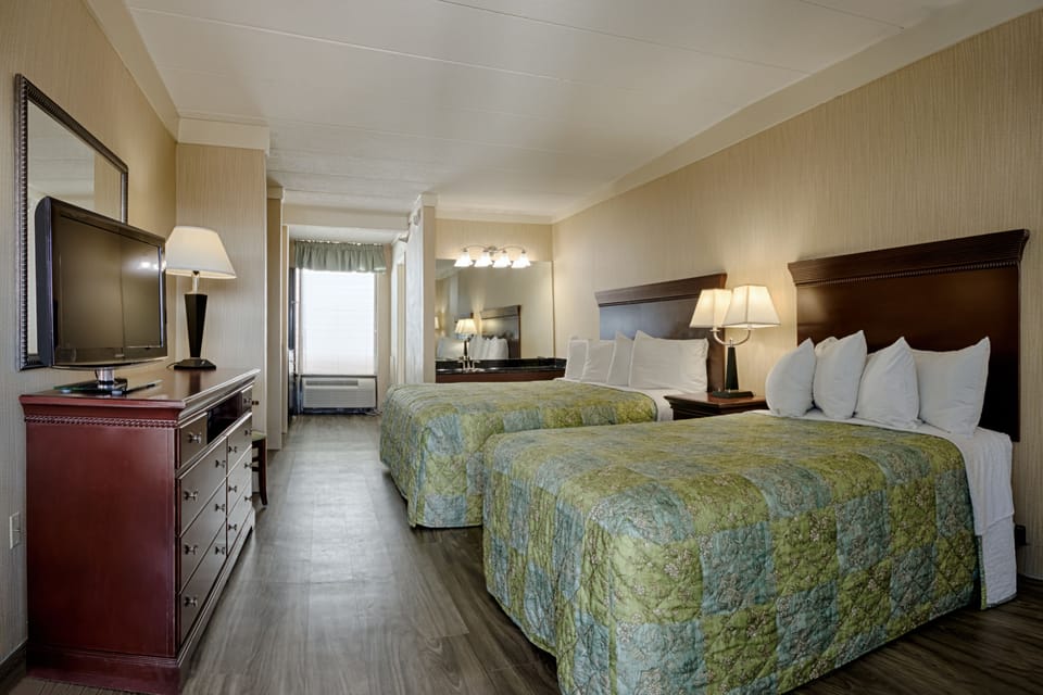 Room, Kitchenette (Efficiency, King Bed & One Double Bed) | Iron/ironing board, cribs/infant beds, rollaway beds, free WiFi