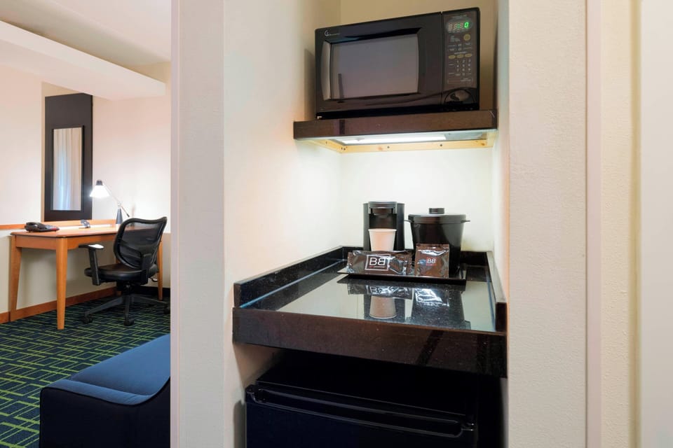 Desk, blackout drapes, iron/ironing board, free cribs/infant beds