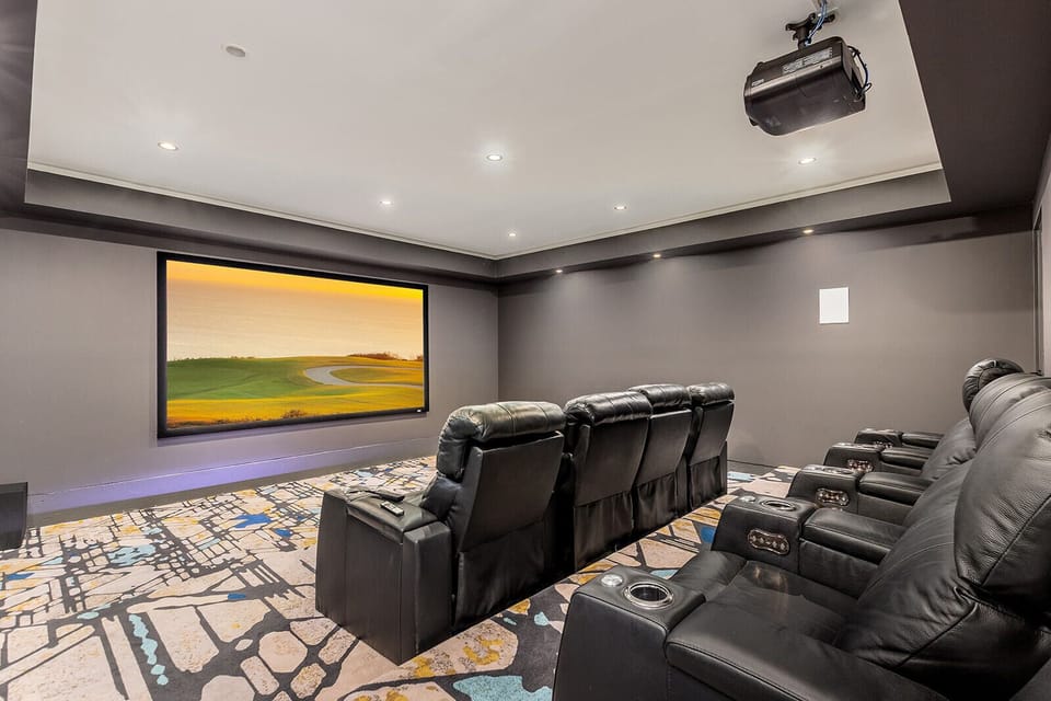 The ultimate movie night upgrade. Plush seating, surround sound, and a massive screen make this home theater an unforgettable experience.