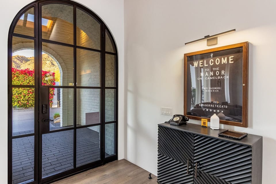First impressions matter. Step through arched glass doors into a space that feels curated, cozy, and distinctly Arizona.