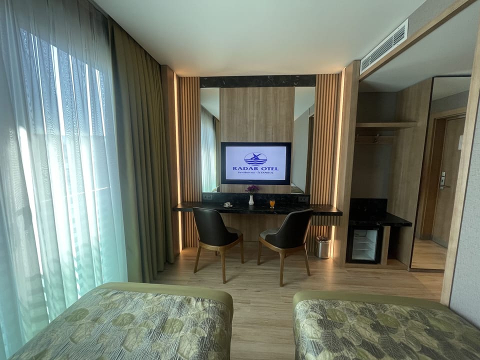Standard Twin Room | Minibar, in-room safe, desk, laptop workspace