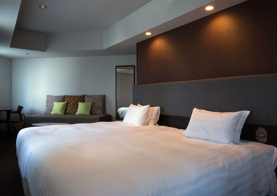 Down comforters, pillowtop beds, desk, blackout drapes