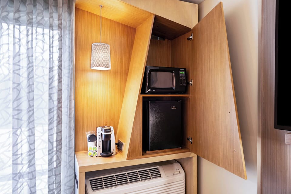 Desk, laptop workspace, blackout drapes, iron/ironing board
