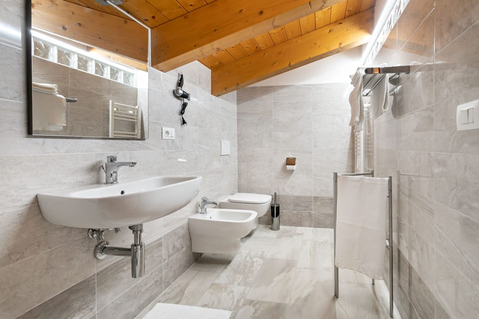 Luxury Room, 2 Bedrooms (3) | Bathroom | Shower, rainfall showerhead, hair dryer, bidet