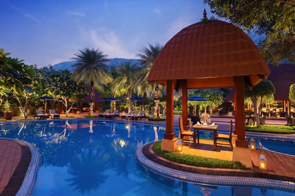 Outdoor pool, open 7:00 AM to 7:00 PM, pool umbrellas, sun loungers