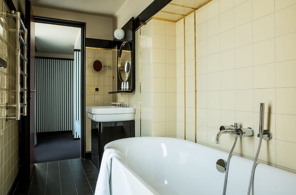 Designer toiletries, hair dryer, bathrobes, slippers
