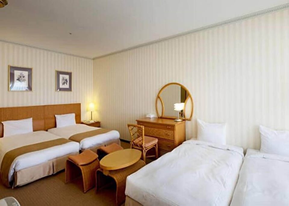 Balcony Quadruple Room (2 single + 2 extra beds), Non Smoking | Premium bedding, down comforters, in-room safe, desk