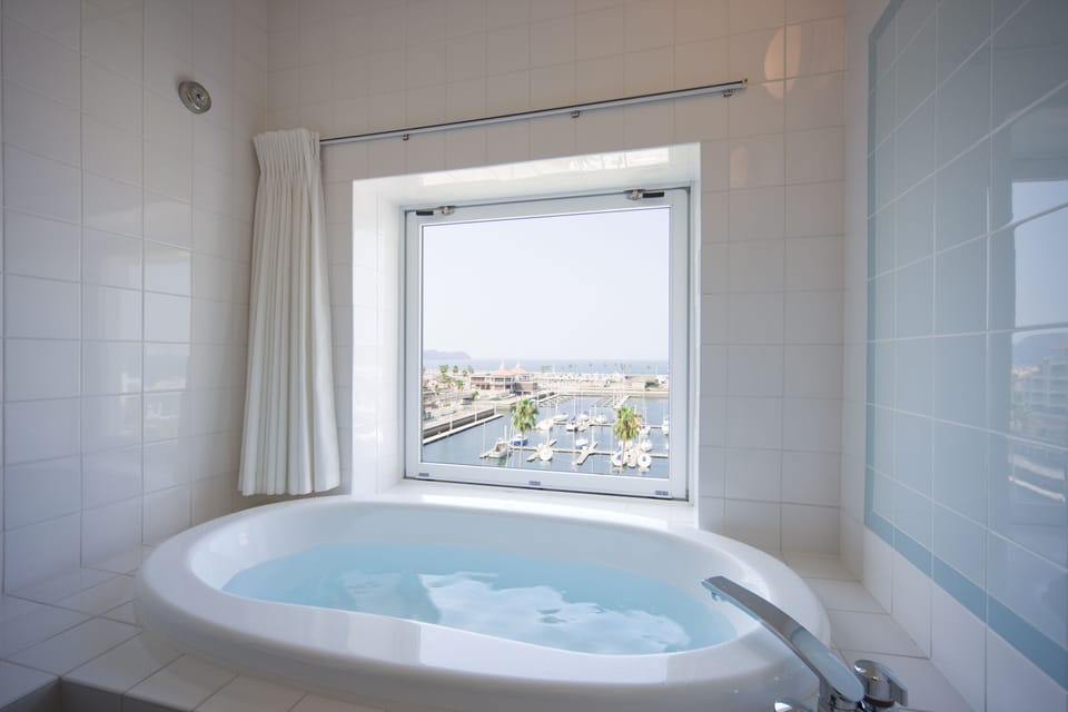 Separate tub and shower, free toiletries, hair dryer, slippers