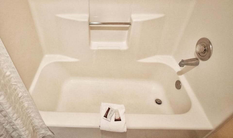 Combined shower/tub, hair dryer, towels, soap